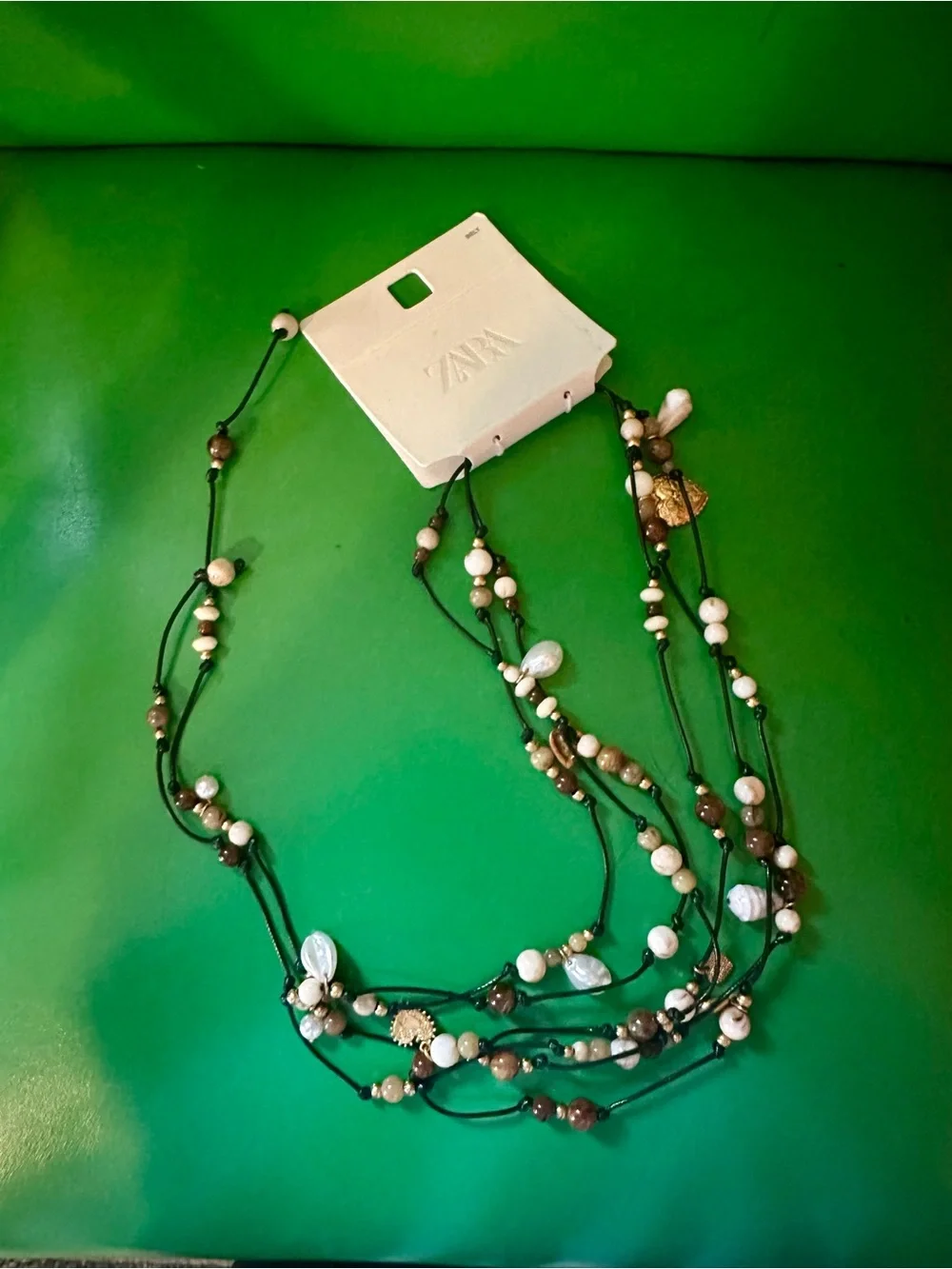 Zara Layered Bead Necklace in White and Brown with Gold Accents - Picture 1 of 4